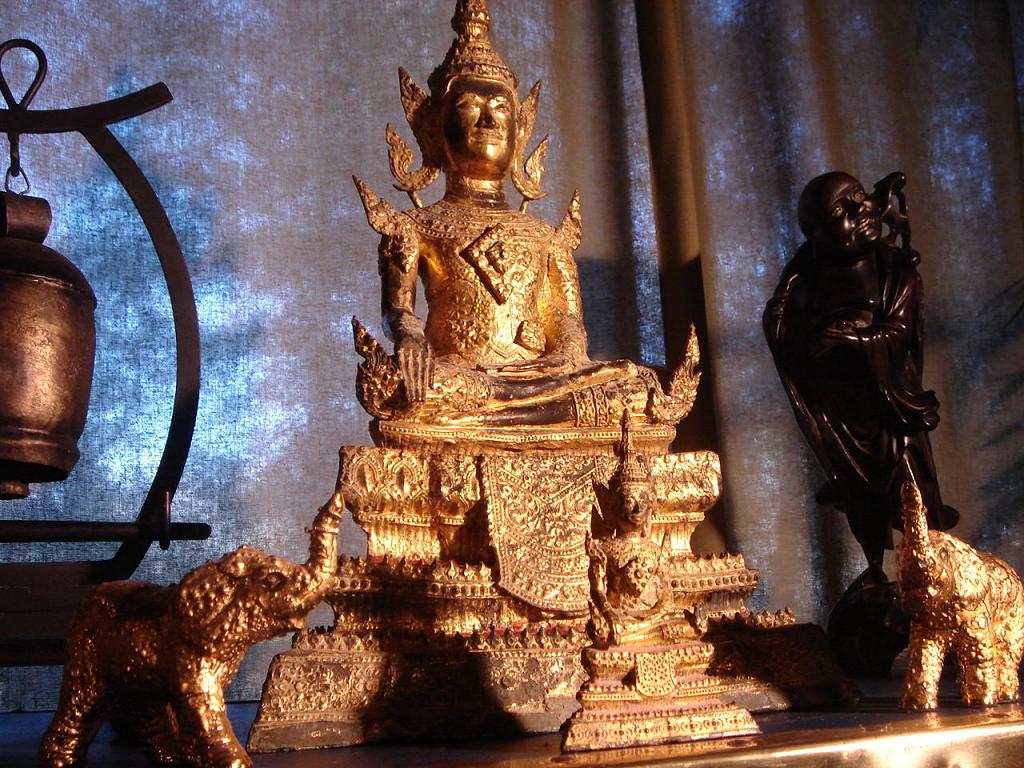 Douglas Wayne's home Buddha Shrine the center piece being a bronze Rattanakosin Gilded Buddha (17 inches tall) with two small 24k gold elephants, an Ebony Buddha and Small Temple Bell