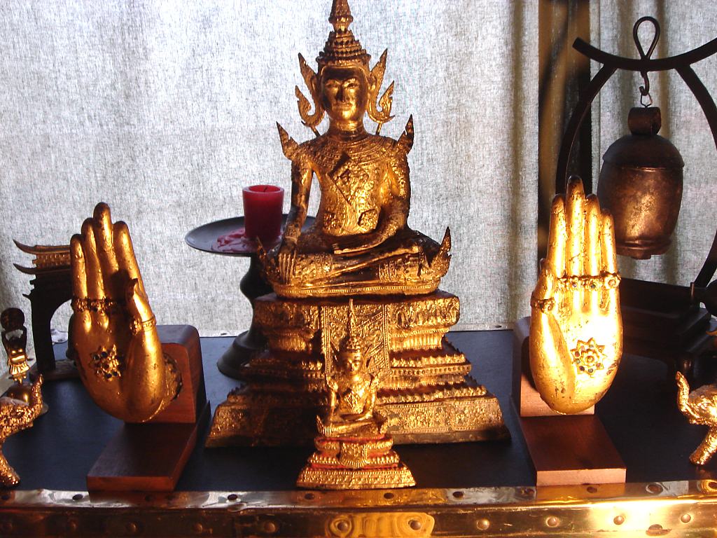 Douglas Wayne's home Buddha Shrine including gilded hands from a large temple statue