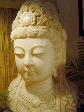 Kwan Yin. aka Kannon in Japanese, is a Boddhisatva incarnation of the goddess of  Mercy